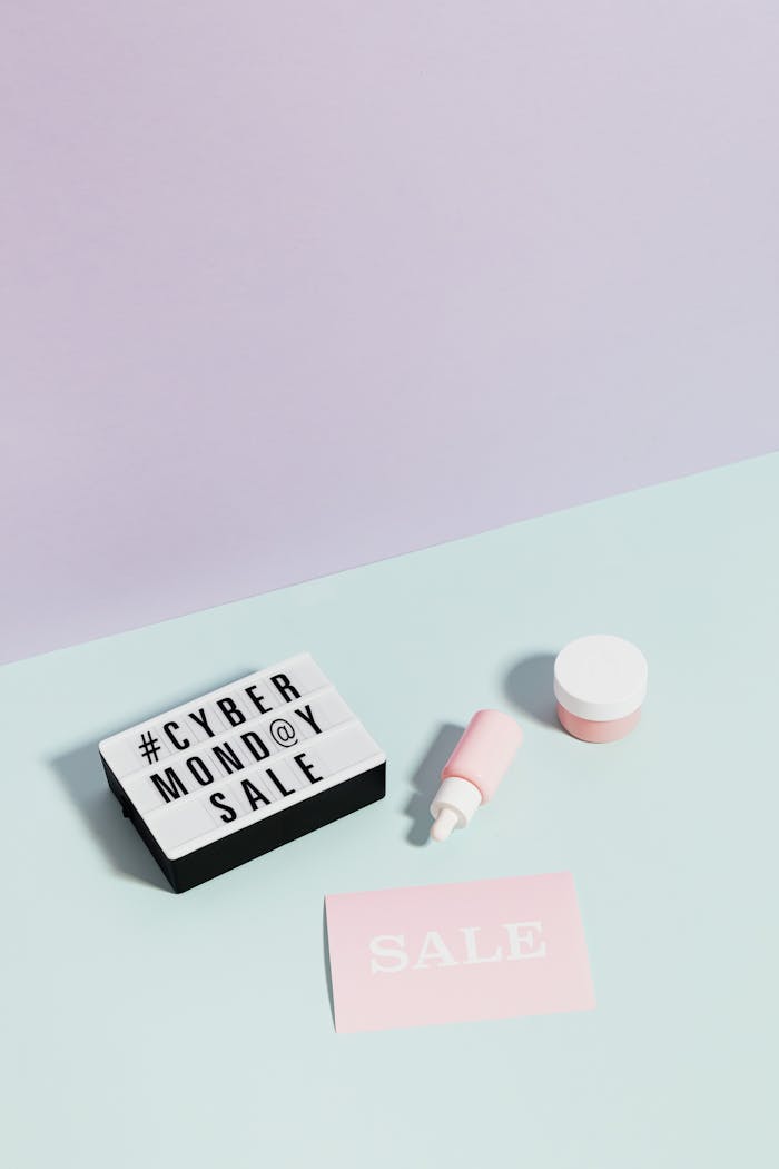 About Flat lay of beauty products and sale signs highlighting Cyber Monday discounts.
